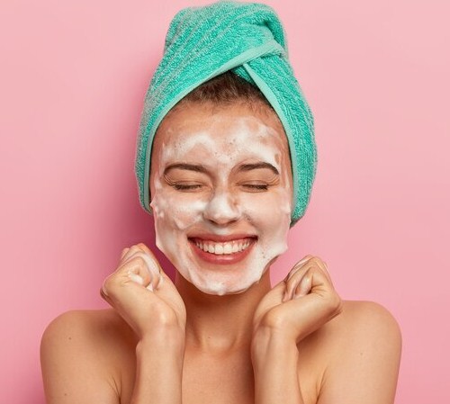 by cleansing your face to remove overnight oil and impurities.