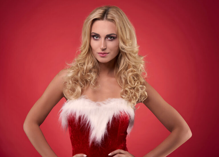 A model with Hollywood waves wearing a sequined dress