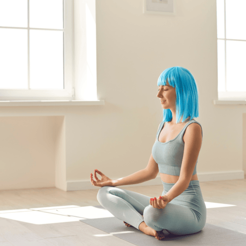 A person meditating in a calm and peaceful environment.