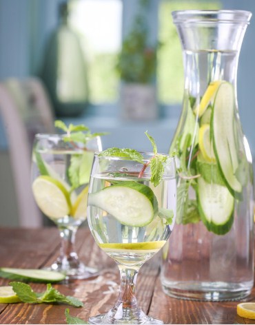 A glass of lemon water with mint leaves for hydration and detox.