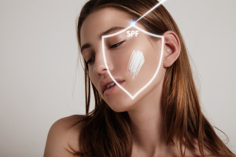 woman a shield makes spf protection from UV ray