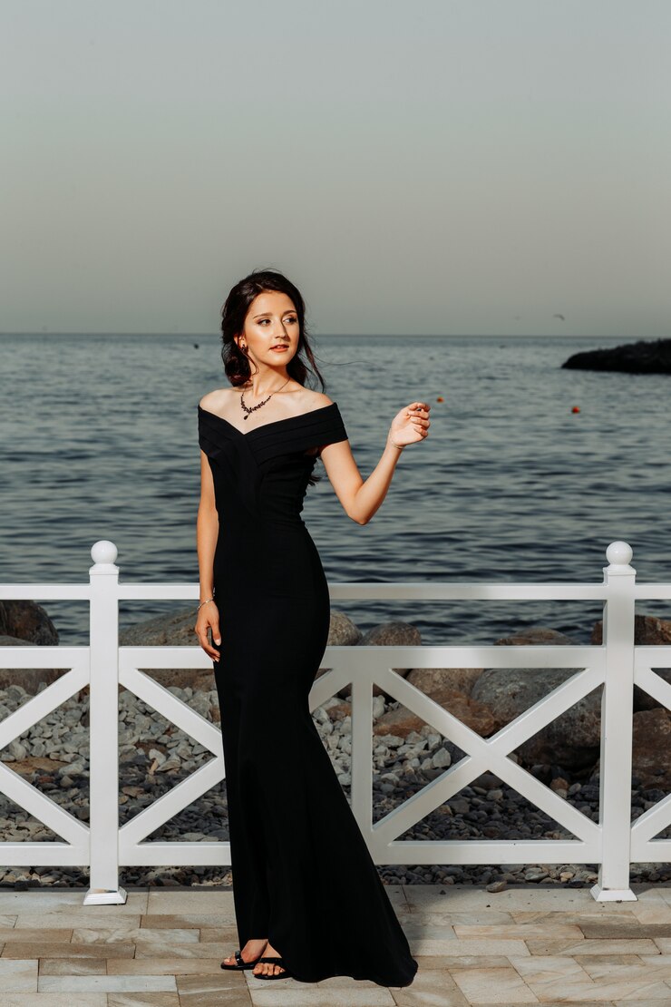 girl standing long black dress